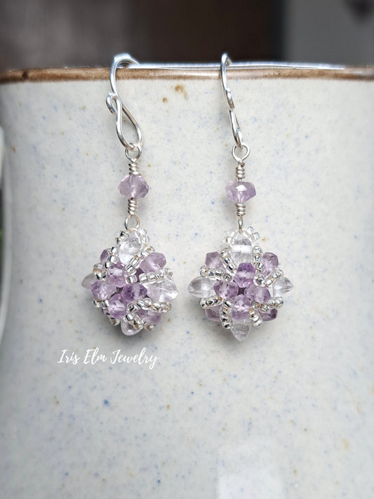 amethyst and quartz crystal handmade beadwork sterling silver earrings on ceramic surface by Iris Elm Jewelry