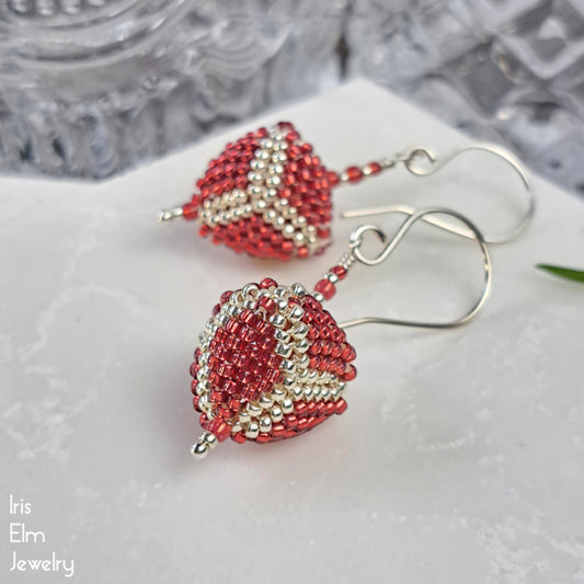 Red and silver beaded triangle glass sterling silver handmade earrings on a white surface with 'Iris Elm Jewelry' branding.