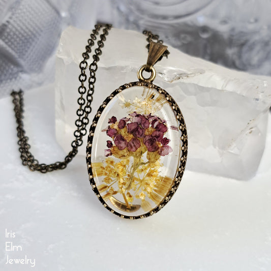 Small Oval Red, Yellow, and White Wildflower Resin Pendant Necklace - Antiqued Brass