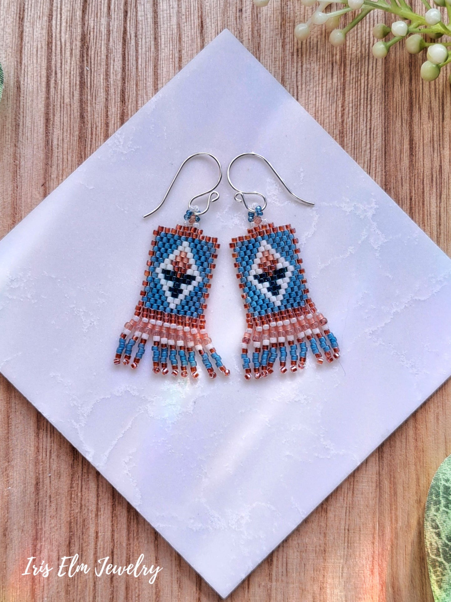 Beaded mini seed bead fringe tulip earrings on a white tile with 'Iris Elm Jewelry' branding.