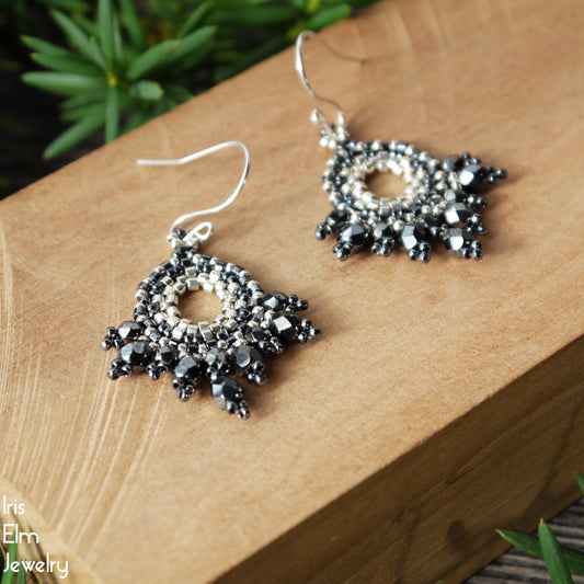 Silver and dark pewter grey Czech glass beaded fan earrings on a wooden surface with 'Iris Elm Jewelry' branding.