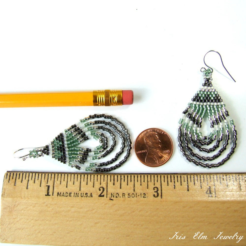 Beaded teardrop shaped earrings with a pencil and penny for scale, Iris Elm Jewelry
