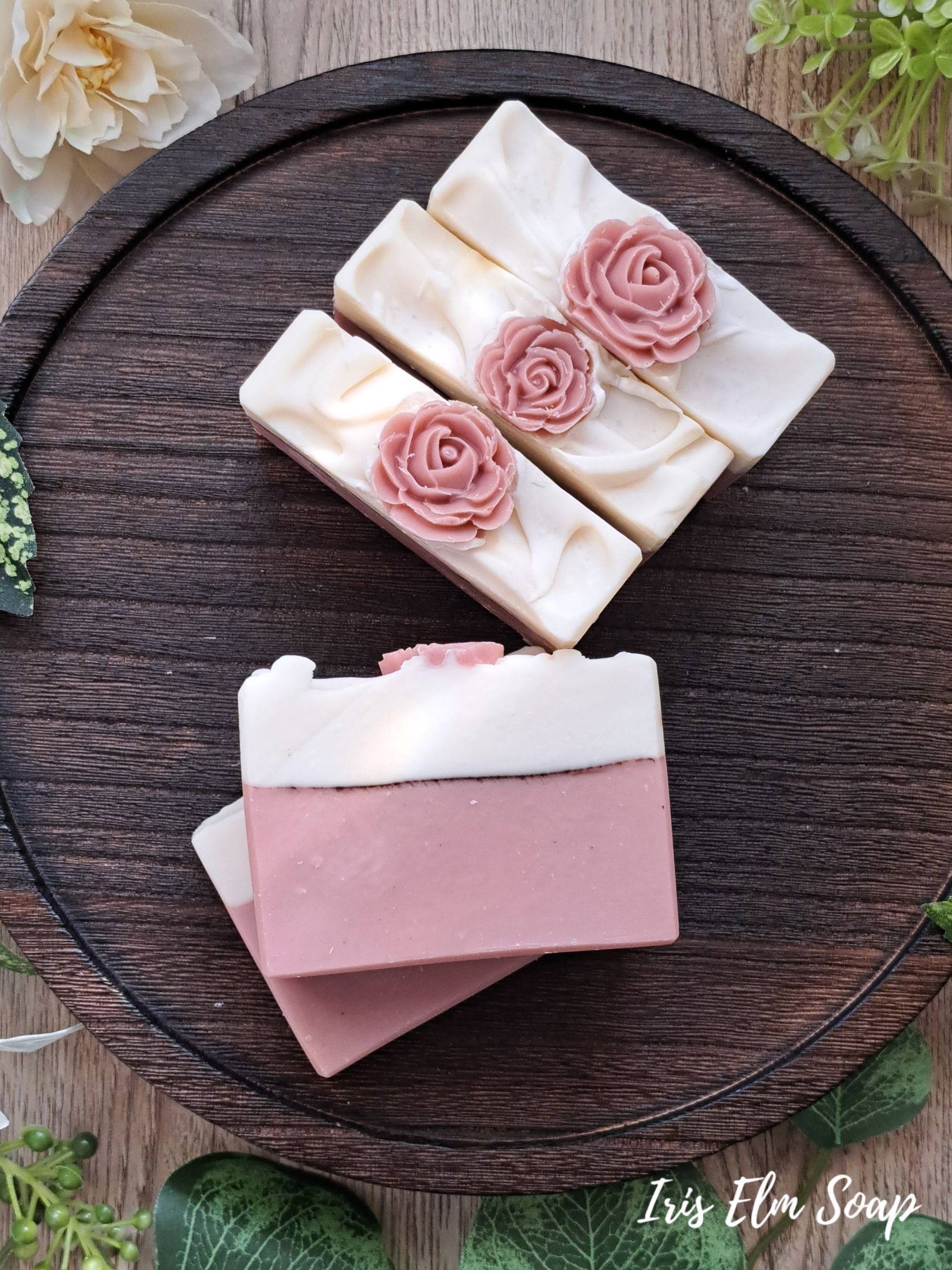 pink and white rose clay rose scented handmade soap bars on wooden tray