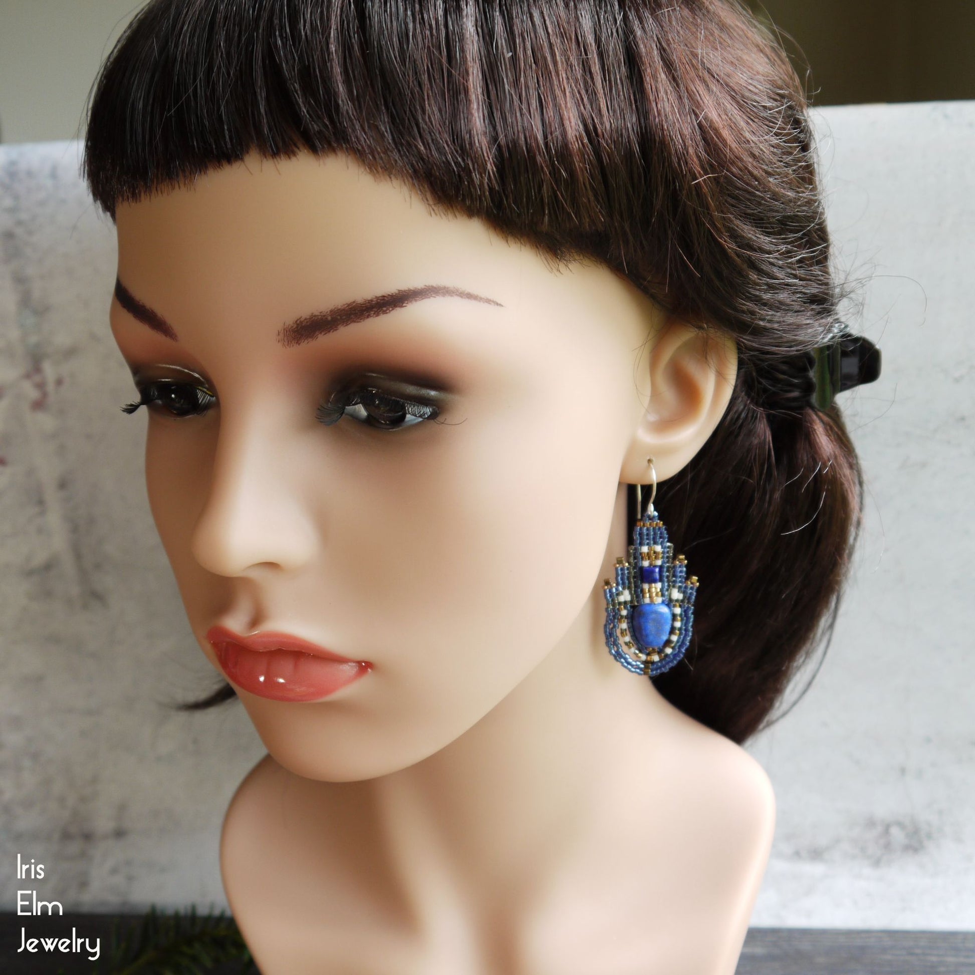 mannequin wearing blue lapis lazuli beaded earrings