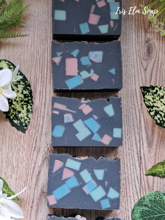 Decorative terrazzo sea salt and orchid handmade soap bars with colorful geometric pattern on a wooden surface, branded 'Iris Elm Soap'.