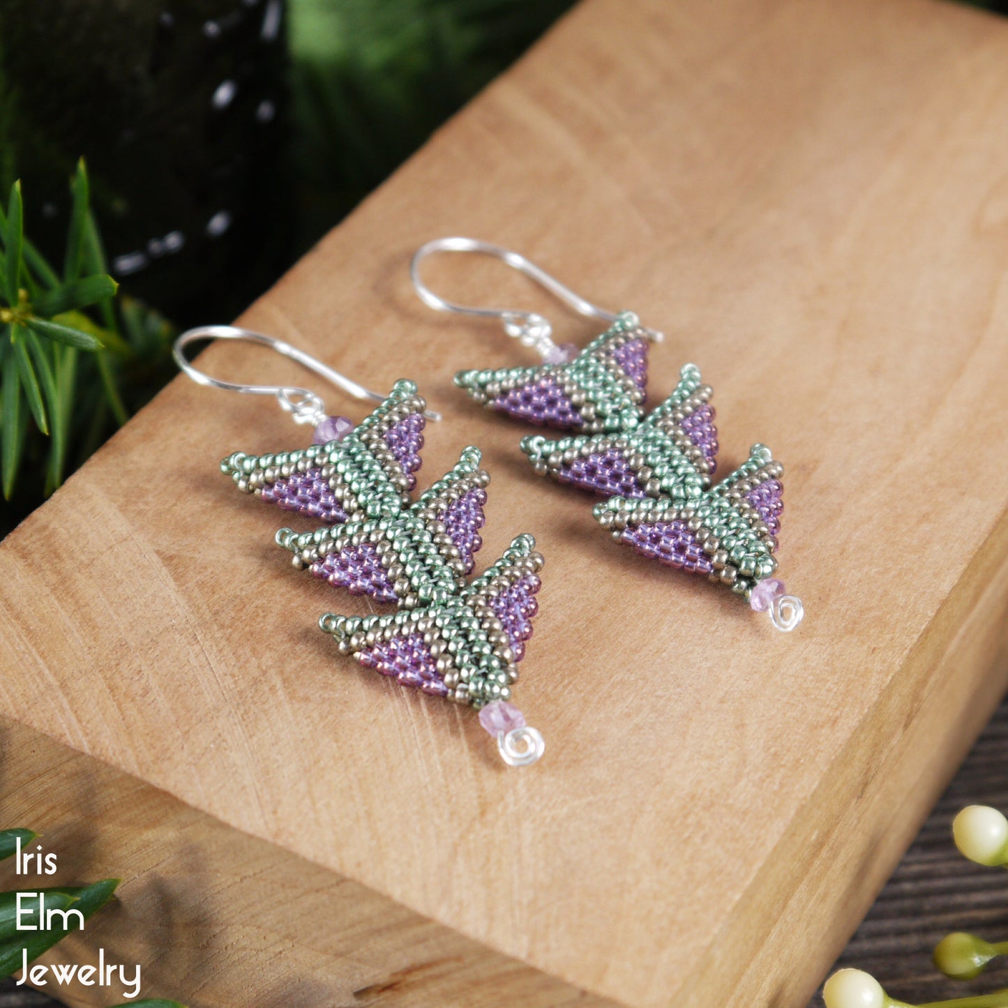 three tier triangle seed bead sterling silver beaded earrings on a wooden surface with 'Iris Elm Jewelry' branding.