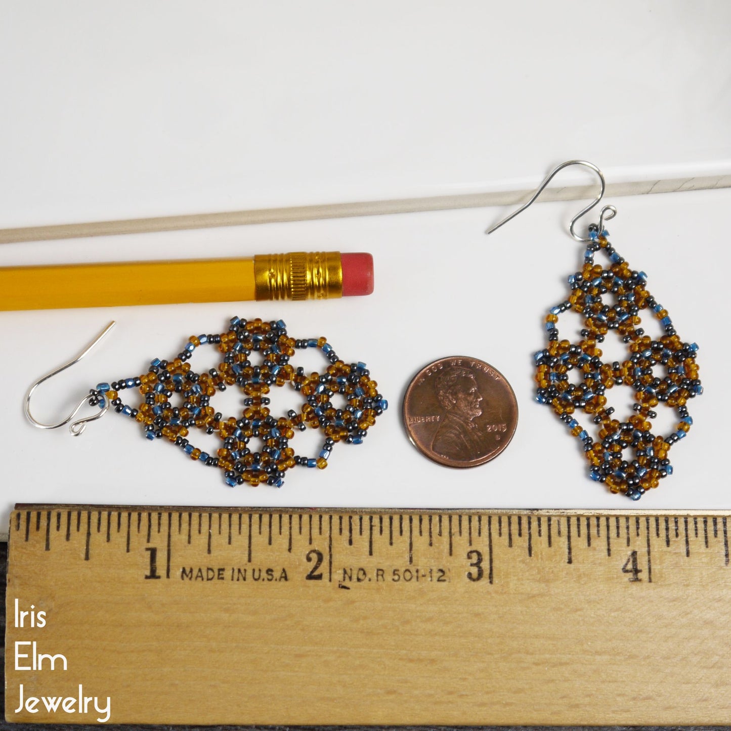2 and 3/8 inch long beaded earrings next to a penny and a ruler, with 'Iris Elm Jewelry' branding.