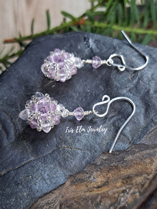 amethyst and quartz crystal handmade beadwork sterling silver earrings on stone surface by Iris Elm Jewelry