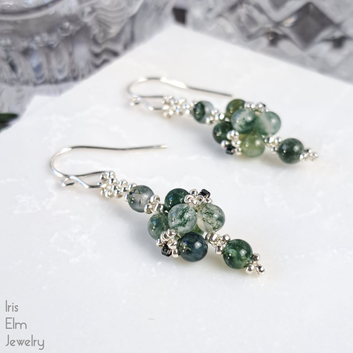 Green moss agate small beaded earrings on a white surface with 'Iris Elm Jewelry' branding.