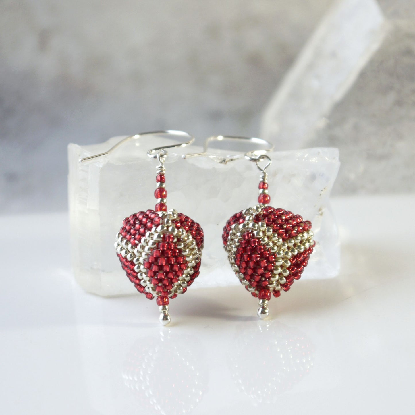 red and silver 3d triangle beadwork seed bead beaded earrings on a white background