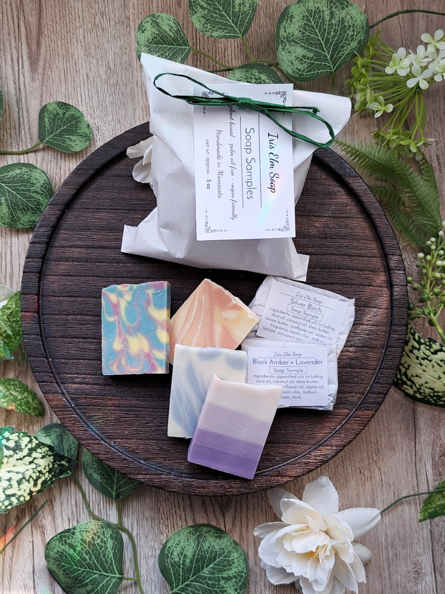 Iris Elm Soap Handmade soap bars sample pack on a wooden tray with greenery and flowers