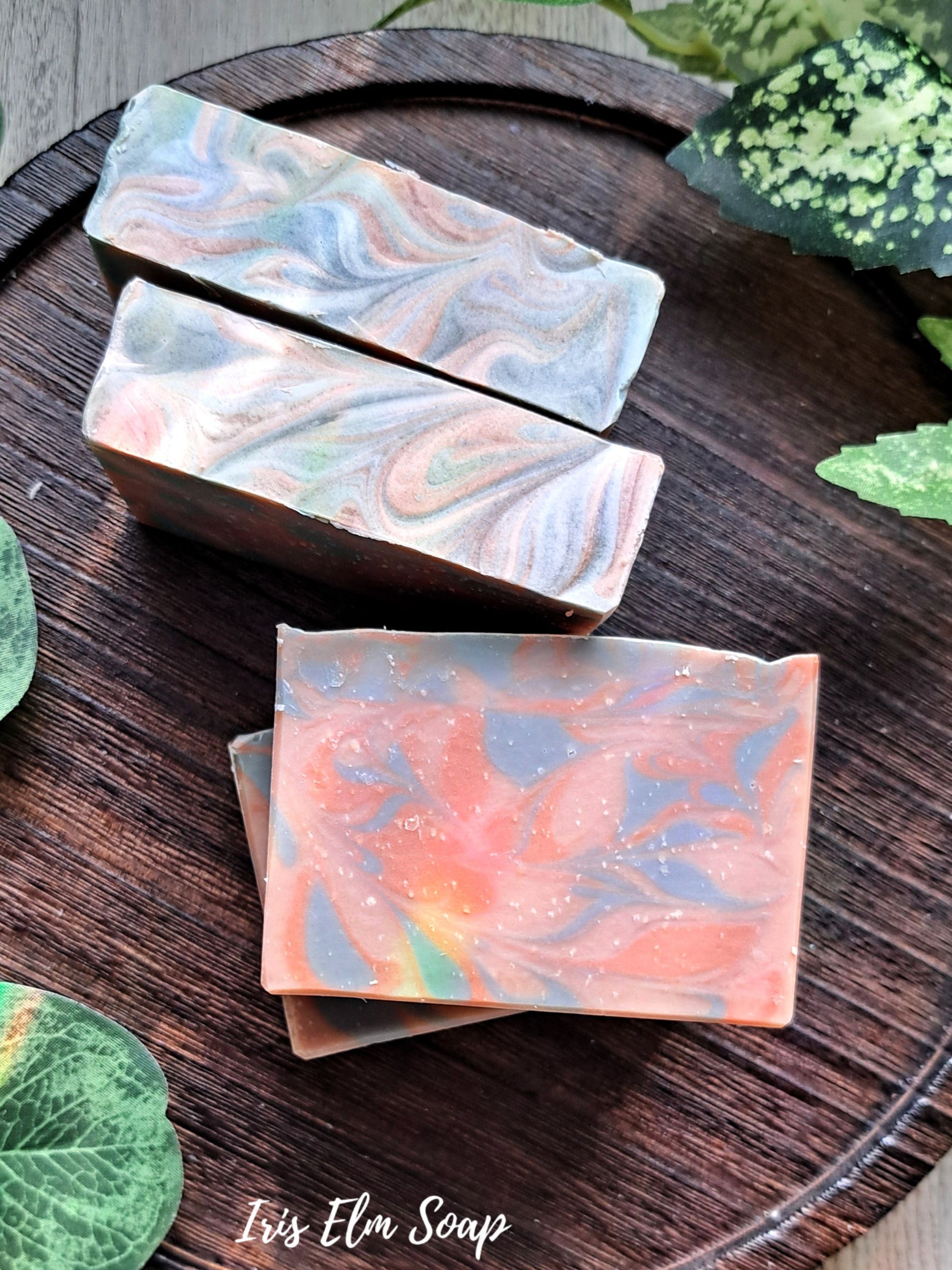 amber rosewood handmade soap bars on dark wooden surface with Iris Elm Soap branding