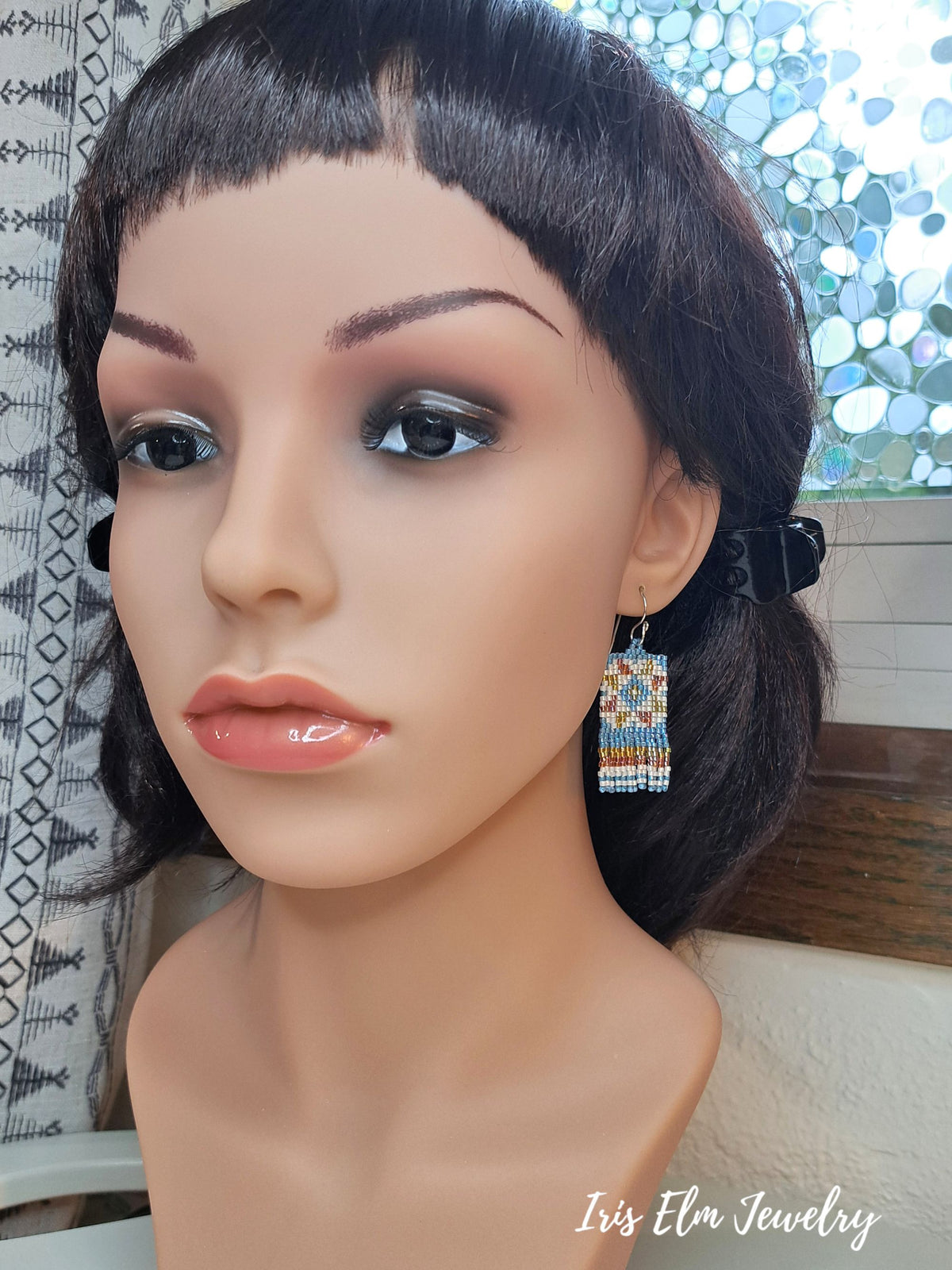 mannequin wearing quilt block patterned seed bead fringe earrings