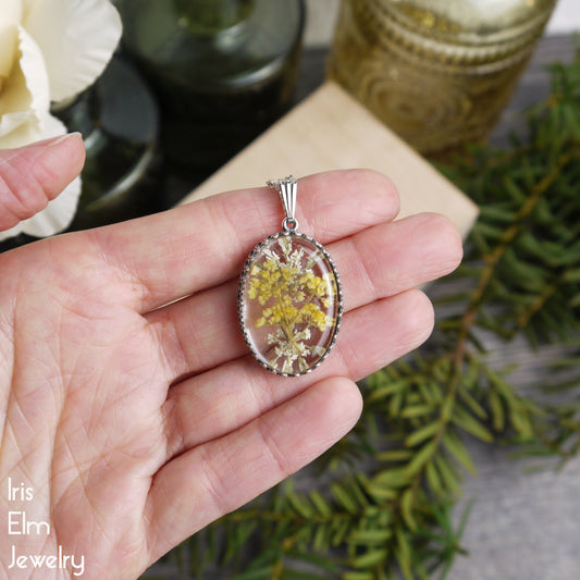 Yellow Minnesota Wildflower in Resin Oval Pendant Necklace - Antiqued Silver Tone